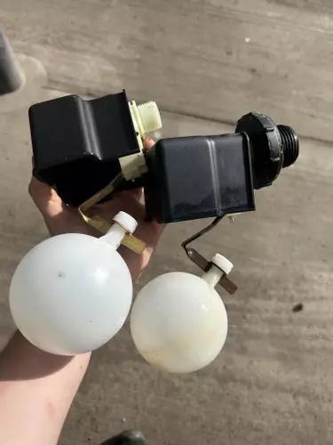 Comparison of old and new float valves used for water tank level control on a pressure washer system. The upgraded float valve provides more reliable water regulation, helping prevent overflows, dry running, and inconsistent water supply issues.